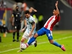 Argentina's Lionel Messi and Paraguay Santiago Arzamendia battle for the ball during a Copa America soccer match Argentina's Lionel Messi and Paraguay Santiago Arzamendia battle for the ball during a Copa America soccer match