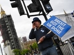 Steve Bray, anti-Brexit protester, shouts slogans while holding a placard that reads "Brexit Got The UK Done" in Westminster in London, UK.