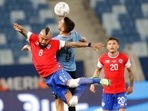 Uruguay's Matias Vecino and Chile's Arturo Vidal go for a header during a Copa America soccer match(AP) Uruguay's Matias Vecino and Chile's Arturo Vidal go for a header during a Copa America soccer match(AP)