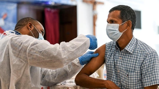 FILE PHOTO: A man receives a dose of a vaccine against the coronavirus disease (COVID-19) at St. Paul's Church in Abu Dhabi, United Arab Emirates January 16, 2021. REUTERS/Khushnum Bhandari/File Photo(REUTERS)