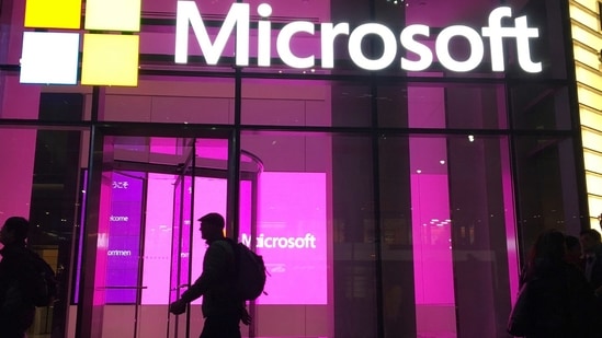 People walk near a Microsoft office in New York. (AP) People walk near a Microsoft office in New York. (AP)