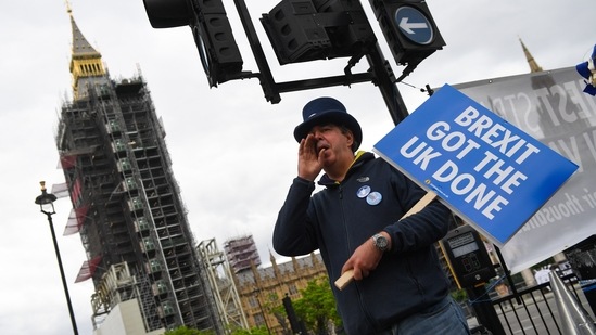 Steve Bray, anti-Brexit protester, shouts slogans while holding a placard that reads "Brexit Got The UK Done" in Westminster in London, UK. (Bloomberg) Steve Bray, anti-Brexit protester, shouts slogans while holding a placard that reads "Brexit Got The UK Done" in Westminster in London, UK. (Bloomberg)