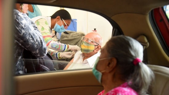 Senior citizens getting inoculated against Covid-19 at a drive-in vaccination centre in Kandivali, Mumbai on June 21. The Centre has so far distributed close to 300 million vaccine doses to states, of which nearly 270 million doses have been consumed, HT reported.(Vijay Bate / HT Photo)