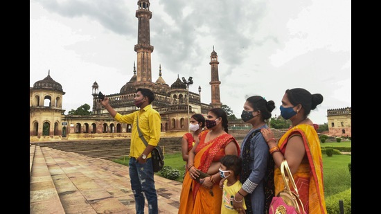 Lucknow: Visitors take selfie at Bada Imambara that reopened after some ease in Covid 19 lockdown, in Lucknow. (PTI) Lucknow: Visitors take selfie at Bada Imambara that reopened after some ease in Covid 19 lockdown, in Lucknow. (PTI)