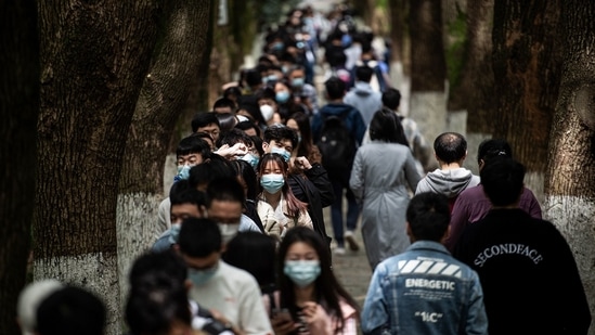 This photo taken on April 28, 2021 shows university students queueing to receive the China National Biotec Group (CNBG) Covid-19 coronavirus vaccine at a university in Wuhan, in China's central Hubei province.(AFP)