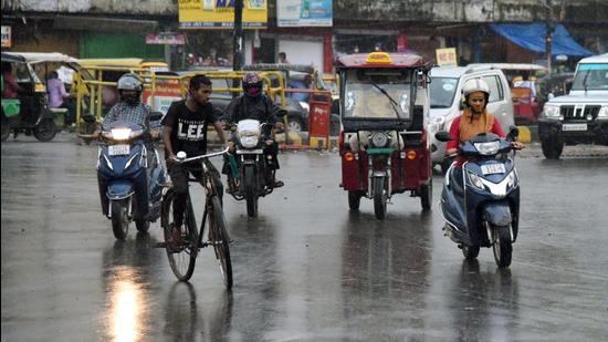 People ride through rain near Kargil Chowk in Patna, Bihar, on Monday June 21. (Santosh Kumar /HT photo) People ride through rain near Kargil Chowk in Patna, Bihar, on Monday June 21. (Santosh Kumar /HT photo)