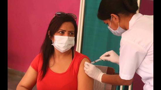 A woman getting vaccinated at a centre in Sector 40, Chandigarh, on Tuesday. (KESHAV SINGH/HT) A woman getting vaccinated at a centre in Sector 40, Chandigarh, on Tuesday. (KESHAV SINGH/HT)