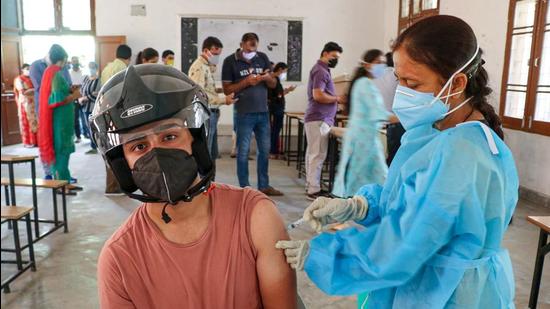 A beneficiary receives a dose of Covid-19 vaccine at a vaccination centre in Jammu on Tuesday. (PTI) A beneficiary receives a dose of Covid-19 vaccine at a vaccination centre in Jammu on Tuesday. (PTI)