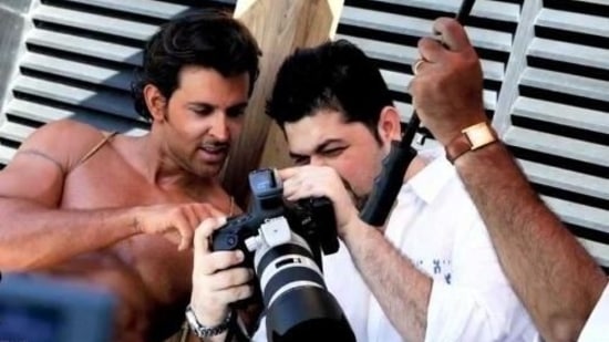 Hrithik Roshan and Dabboo Ratnani discuss a shot.