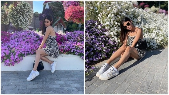 Who said summer dresses can’t be in black hues? Mouni looks absolutely breathtaking in this black spaghetti strap dress adorned with white floral embroidery all over. She wore the mini outfit with Louis Vuitton shoes, a Prada bag and sunglasses.(Instagram/@imouniroy)