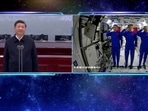 Chinese astronauts salute as they speak to President Xi Jinping via a video call from the Tianhe core module of China's space station.
