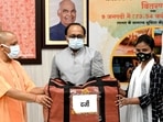 Uttar Pradesh Chief Minister Yogi Adityanath distributes loans and tool kits to beneficiaries during an online swarozgar Sangam at his official residence in Lucknow. (ANI Photo) Uttar Pradesh Chief Minister Yogi Adityanath distributes loans and tool kits to beneficiaries during an online swarozgar Sangam at his official residence in Lucknow. (ANI Photo)
