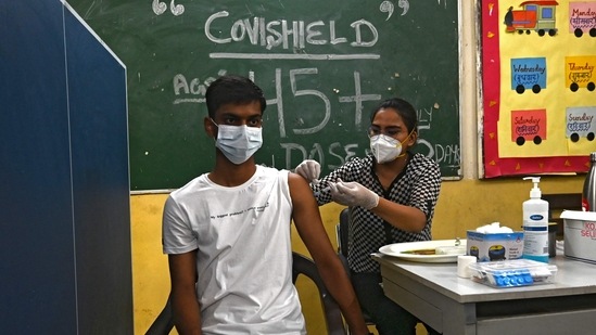 A health worker inoculates a man with a jab of Covid-19 vaccine at a vaccination Centre in Delhi. A health worker inoculates a man with a jab of Covid-19 vaccine at a vaccination Centre in Delhi.