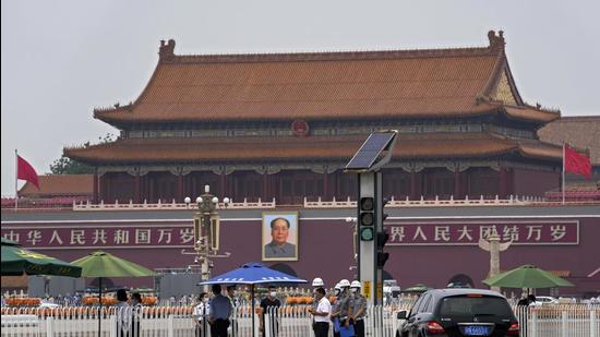 An official and security personnel get checked at an entrance to Tiananmen Square in Beijing on Wednesday. Chinese authorities have closed Beijing’s central Tiananmen Square to the public, eight days ahead of a major celebration being planned to mark the 100th anniversary of the founding of the ruling Communist Party. (AP) An official and security personnel get checked at an entrance to Tiananmen Square in Beijing on Wednesday. Chinese authorities have closed Beijing’s central Tiananmen Square to the public, eight days ahead of a major celebration being planned to mark the 100th anniversary of the founding of the ruling Communist Party. (AP)