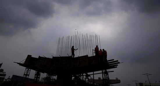 Labourers work during an overcast evening at Ashram Chowk in New Delhi. (Raj K Raj/Hindustan Times) Labourers work during an overcast evening at Ashram Chowk in New Delhi. (Raj K Raj/Hindustan Times)