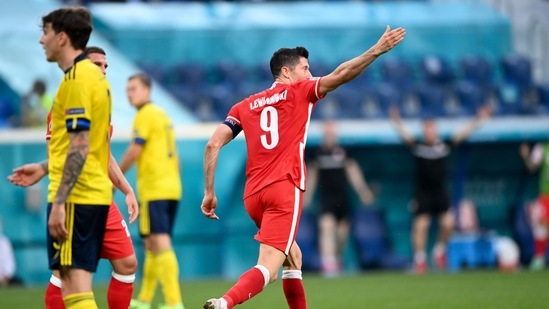 Poland's Robert Lewandowski celebrates after scoring his side's 2nd goal during the Euro 2020 soccer championship group D match between Sweden and Poland, at the St. Petersburg stadium in St. Petersburg, Russia, Wednesday, June 23, 2021. (AP Photo/Kirill Kudryavtsev, Pool)(AP)