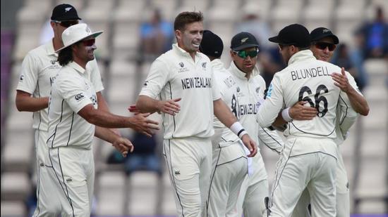 New Zealand's Tim Southee celebrates with teammates the dismissal of India's Jasprit Bumrah during the sixth day of the World Test Championship final at the Rose Bowl in Southampton on Wednesday. (AP) New Zealand's Tim Southee celebrates with teammates the dismissal of India's Jasprit Bumrah during the sixth day of the World Test Championship final at the Rose Bowl in Southampton on Wednesday. (AP)