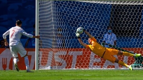What a picture and what a save. Slovakia goalkeeper Martin Dubravka denied Spain the opener as Alvaro Morata's penalty was saved in the 12th minute. (AP)