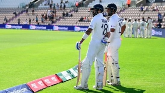 Virat Kohli and Cheteshwar Pujara waiting to get on to the field (Twitter/Blackcaps) Virat Kohli and Cheteshwar Pujara waiting to get on to the field (Twitter/Blackcaps)