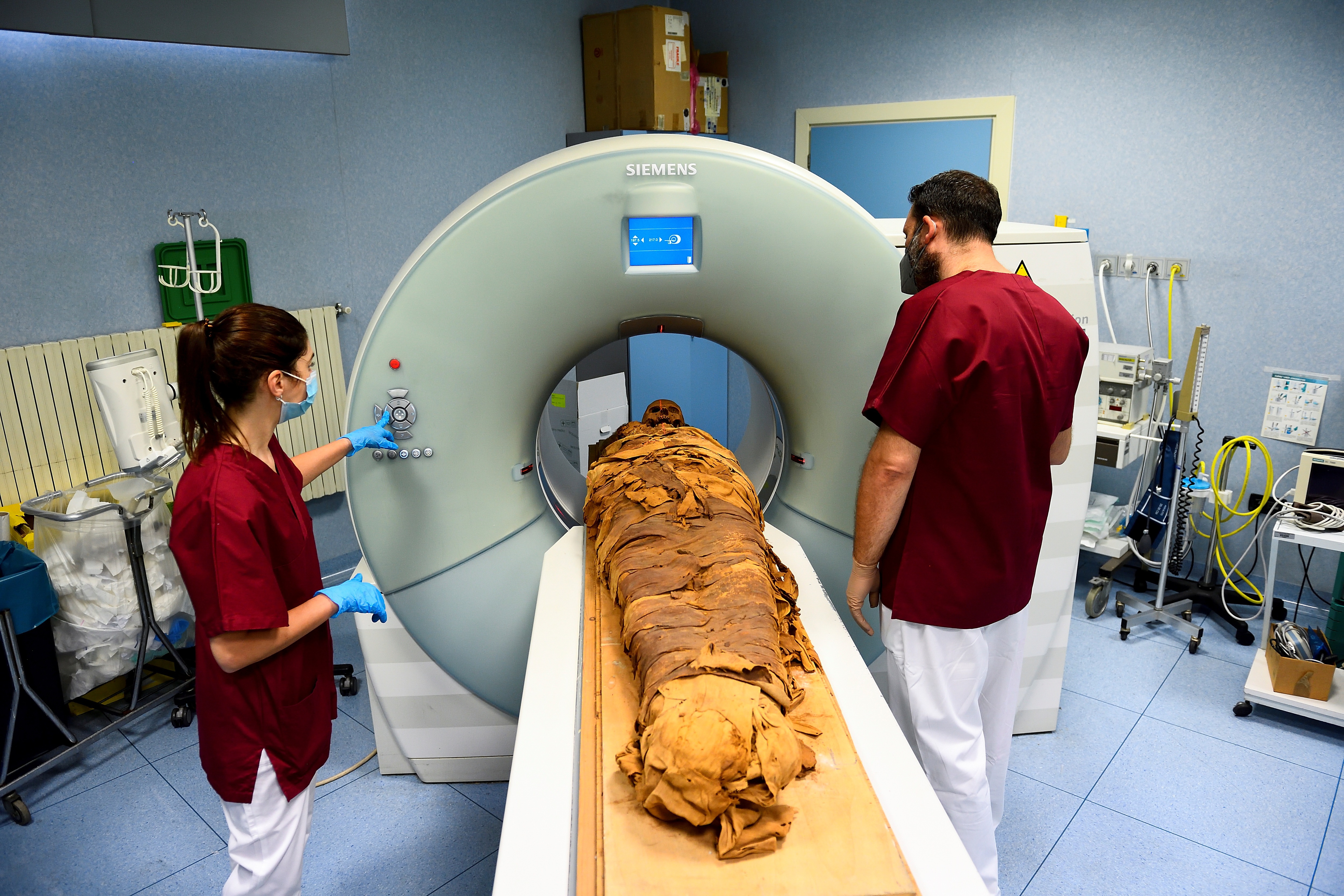 Medical radiology technicians prepares a CT scan to do a radiological examination of an Egyptian mummy. (REUTERS)