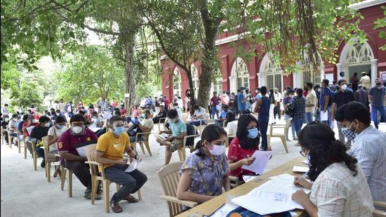 People register for Covid-19 vaccine dose during a special drive for those going abroad for education or employment in Bengaluru on Tuesday, June 22. (PTI)