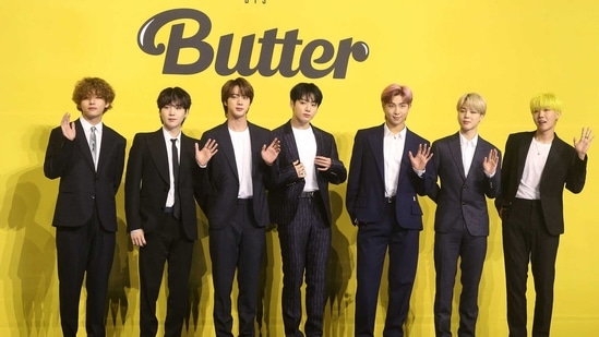 Members of South Korean K-pop boy band BTS pose for photographs during a press conference to promote their new single album 'Butter' in Seoul on May 21, 2021. (Photo by - / Dong-A Ilbo / AFP) / South Korea OUT(AFP)