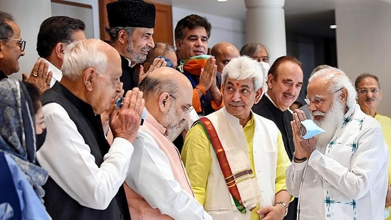 PM Narendra Modi greets Amit Shah, Farooq Abdullah and Mehbooba Mufti among other leaders at the meeting in Delhi on Thursday. (PTI)
