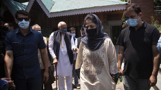 National Conference president Farooq Abdullah and Peoples Democratic Party president Mehbooba Mufti leave after a joint press conference of People's Alliance for Gupkar Declaration (PAGD) in Srinagar, Kashmir, on Tuesday. (AP) National Conference president Farooq Abdullah and Peoples Democratic Party president Mehbooba Mufti leave after a joint press conference of People's Alliance for Gupkar Declaration (PAGD) in Srinagar, Kashmir, on Tuesday. (AP)