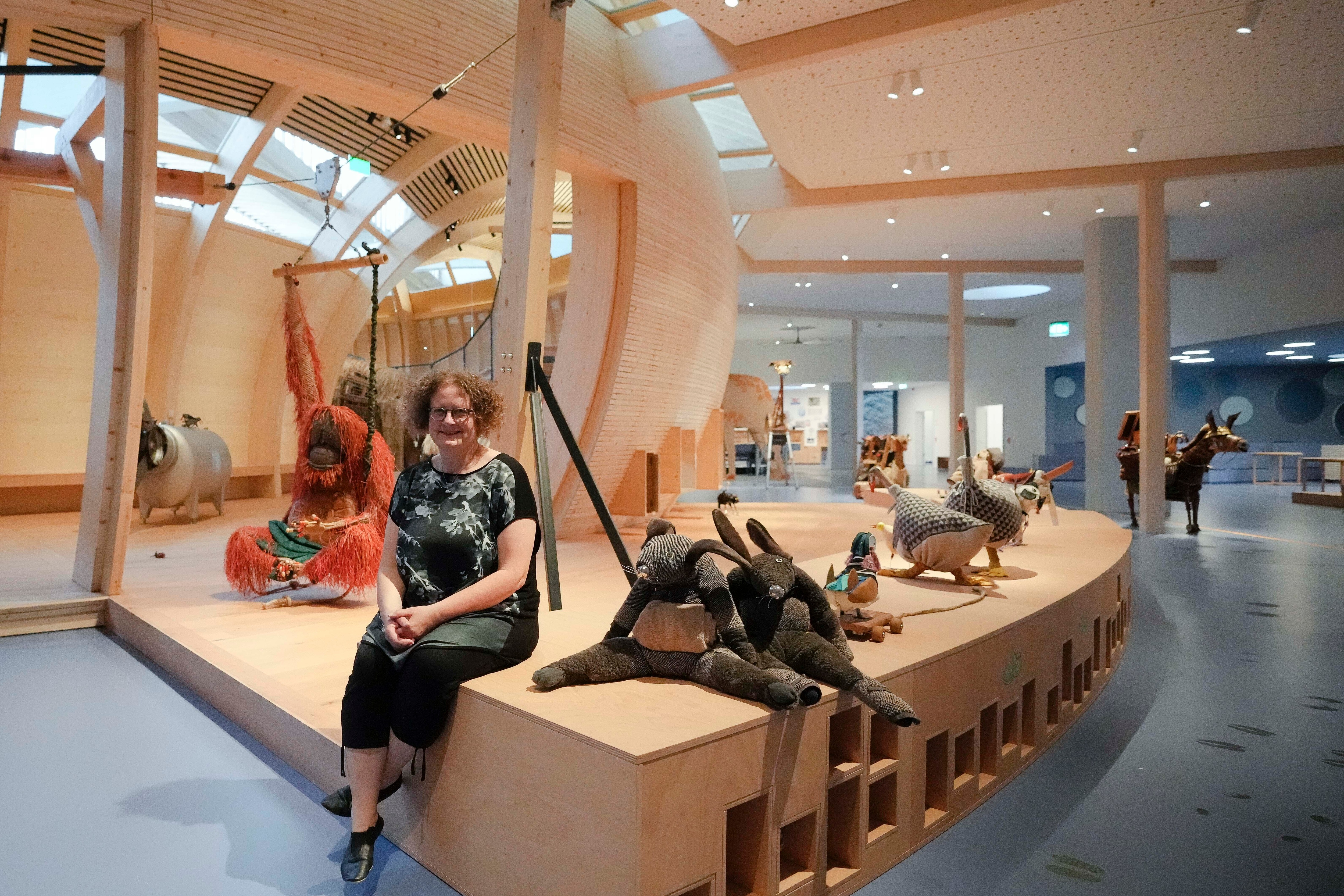 Ane Kleine-Engel, the head of the children's museum at the Jewish Museum pose for a photo as she is sitting between animals that are made out of recycled material, at the interactive exhibit about the story of Noah's Ark, in Berlin, Germany, Monday, June 21, 2021. The Jewish Museum of Berlin is opening a new museum for children between the ages of three and ten.(AP) Ane Kleine-Engel, the head of the children's museum at the Jewish Museum pose for a photo as she is sitting between animals that are made out of recycled material, at the interactive exhibit about the story of Noah's Ark, in Berlin, Germany, Monday, June 21, 2021. The Jewish Museum of Berlin is opening a new museum for children between the ages of three and ten.(AP)