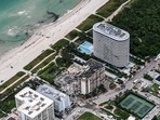 An aerial view shows search and rescue personnel working on the site after the partial collapse of the Champlain Towers South in Surfside, north of Miami Beach, on June 24. The multi-story apartment block in Florida partially collapsed early June 24, sparking a major emergency response.