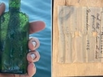 Message in a bottle from 1926 discovered by the diver. Message in a bottle from 1926 discovered by the diver.