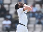Jasprit Bumrah reacts after a catch does down off his bowling. 