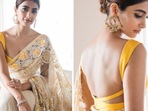Pooja Hegde posed in a yellow saree. Pooja Hegde posed in a yellow saree.