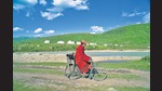 A monk cycling in the Kham region of Western Sichuan in Tibet. (De Agostini via Getty Images) A monk cycling in the Kham region of Western Sichuan in Tibet. (De Agostini via Getty Images)