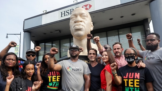 George Floyd's brother Terrence Floyd rises his fist during the George Floyd statue unveiling event in Brooklyn, New York, US.(REUTERS)