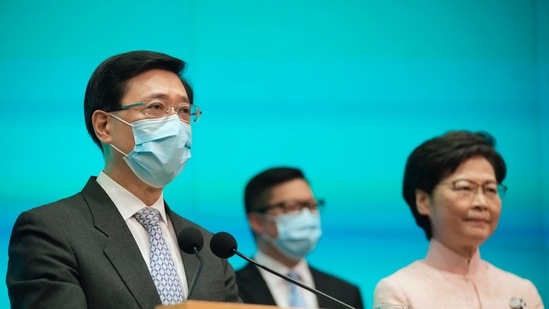 From the right, Hong Kong's Chief Executive Carrie Lam, Secretary for Security Chris Tang, and Chief Secretary John Lee attend a news conference in Hong Kong, on Friday, June 25, 2021. (AP Photo/Kin Cheung)