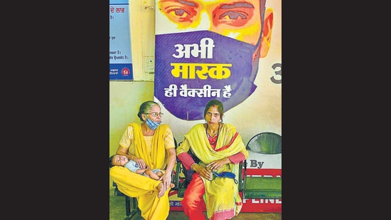 Women disregarding a government advisory on the use of face masks in public places to prevent transmission of the novel coronavirus as they wait for a doctor amid the strike at the Ludhiana civil hospital on Friday. (Gurpreet Singh/HT)