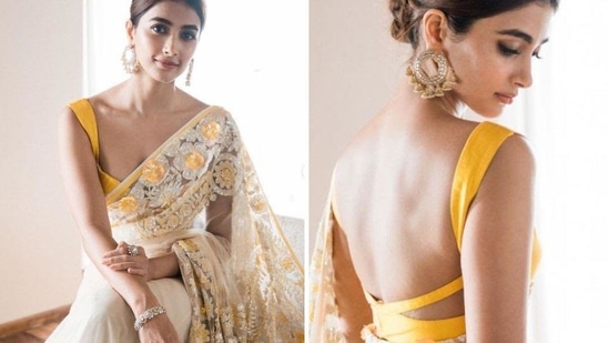 Pooja Hegde posed in a yellow saree.