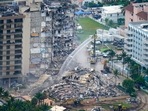 Rescue personnel work at the remains of the Champlain Towers South Condo in Surfside, Florida. Rescue personnel work at the remains of the Champlain Towers South Condo in Surfside, Florida.