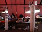 A patient suffering from coronavirus disease (Covid-19) rests on a velbed at a temporary tent outside the emergency ward of a government hospital in Bekasi, on the outskirts of Jakarta, Indonesia, June 25, 2021. 