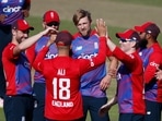 England's David Willey and Moeen Ali celebrate with teammates after taking the wicket of Sri Lanka's Isuru Udana Action Images via Reuters/Paul Childs