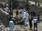 Security officials inspect the site of the explosion in Lahore Security officials inspect the site of the explosion in Lahore