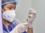 A health worker fills a syringe with a dose of Covid-19 vaccine to administer to a beneficiary at a vaccination centre in Kolkata (PTI) A health worker fills a syringe with a dose of Covid-19 vaccine to administer to a beneficiary at a vaccination centre in Kolkata (PTI)