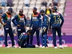 Sri Lanka's Binura Fernando sits on the pitch after trying to runout England's Dawid Malan during the third T20 international cricket match between England and Sri Lanka. Sri Lanka's Binura Fernando sits on the pitch after trying to runout England's Dawid Malan during the third T20 international cricket match between England and Sri Lanka.