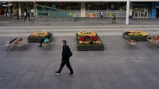 A man walks through the city centre on the first day of a two-week lockdown to curb the Covid-19 outbreak in Sydney, Australia.(Reuters)