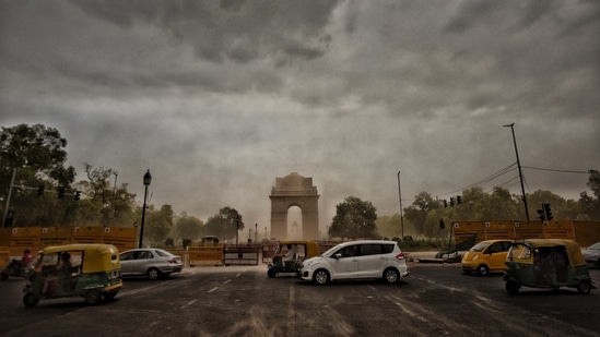 Strong winds blowing dust from the Central Vista construction site in the evening at India Gate in New Delhi, India. Strong winds blowing dust from the Central Vista construction site in the evening at India Gate in New Delhi, India.