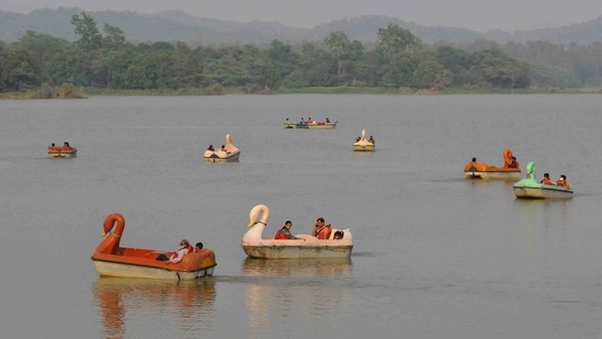 Visitors riding paddle boats at Sukhna Lake in Chandigarh on June 23. The total number of recoveries now stands at 29,193,085, with 64,818 people being discharged in the last 24 hours. The total number of tests done during the previous day was 17,45,809.(Keshav Singh / HT Photo)