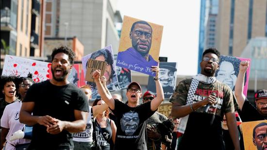 Protesters march during a brief rally after the sentencing of Derek Chauvin, the former Minneapolis policeman found guilty of killing George Floyd, a Black man, in Minneapolis, Minnesota, US, on Friday. (REUTERS)