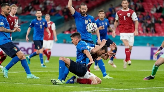 Italy's Matteo Pessina, left, challenges for the ball with Austria's Stefan Lainer during the Euro 2020 soccer championship round of 16 match between Italy and Austria at Wembley stadium in London, Saturday, June 26, 2021. (AP Photo/Frank Augstein, Pool) (AP) Italy's Matteo Pessina, left, challenges for the ball with Austria's Stefan Lainer during the Euro 2020 soccer championship round of 16 match between Italy and Austria at Wembley stadium in London, Saturday, June 26, 2021. (AP Photo/Frank Augstein, Pool) (AP)