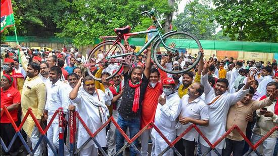 Samajwadi Party supporters during the nomination of the district panchayat president in Varanasi on Saturday. (PTI PHOTO)